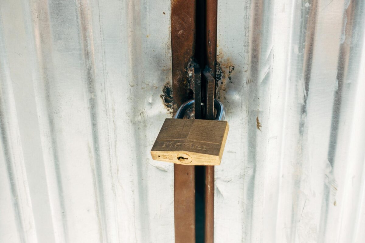 Sturdy padlock securing a metallic gate, symbolizing privacy and data protection